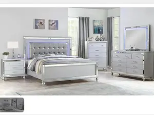 White tufted Lighted bedroom set with night stand, dresser, mirror and chest.