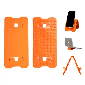 Upgraded flexible silicone phone holder—a rollable suction-cup stand compatible with smartphones and tablets; a multi-angle foldable desktop stand ideal for travel, bedside use, the kitchen, and the office.