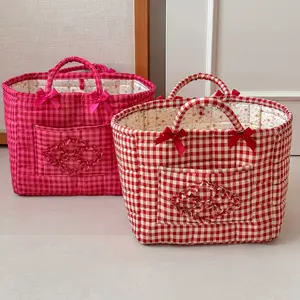 Red grid quilted storage basket with bow detail, girly handheld mom bag