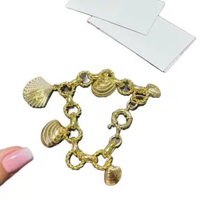 Santiago Jewerly #63 Ocean Charm Bracelet Gold Plated 14k 7 Inch Plus Extension 9 with Shell Charms