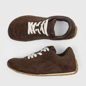 Men’s Brown Suede Retro Running Sneakers. Full suede upper with curved stitching details, paired with thick white laces for vintage aesthetic. Durable gum rubber outsole delivers reliable traction, soft leather lining ensures all-day comfort
