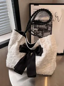 Sweet  cool three-dimensional embossed bag, black bow niche design bag, textured black and white contrast, fashionable and exquisite, versatile and large capacity, suitable for students, office workers, commuting, etc. Embossed Shoulder Bag