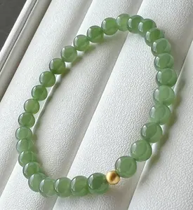 Elegant 6mm Green Nephrite Jade Bracelet with 18k Gold Accent Bead - Dainty Stretch Cord for Comfort & Youth Jewelry