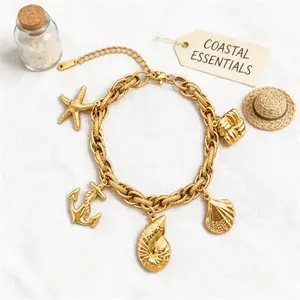 Bohemian vacation tropical ocean-style gold adjustable bracelet with starfish, anchor, and shell ocean element pendants; a versatile fashion accessory for everyday casual outfits.