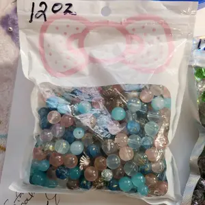 12 oz bag of class beads  with charms and string for $8