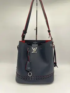 Pre-owned Louis Vuitton Leather Crossbody Bags Lock Me Bucket Bag in Navy Textured with Silver Toned Hardware