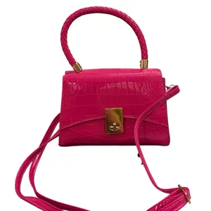 Elegant Pink Handbag with Gold Accents and Secure Closure for Everyday Use