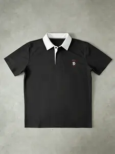 Black and white 'Lion Emblem' polo shirt - a must-have for business and leisure | contrasting collar design | perfect for office commuting, leisure outings, and | # LionEmblemPolo # luxury business and leisure # contrasting collar shirt