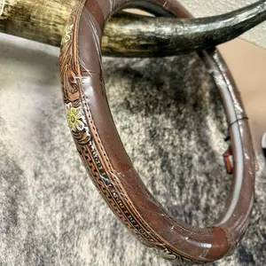 Tooled Leather Steering Wheel with Intricate Floral Embroidery and Colorful Beaded Accents