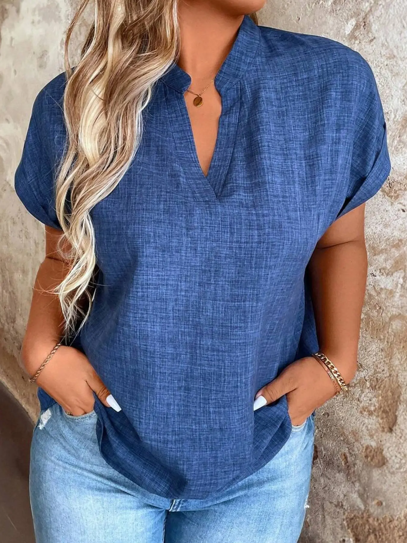 A women's casual V-neck short-sleeve blouse top in a low-saturation deep blue, featuring a loose, dropped-shoulder fit. Suitable for everyday casual wear, light commuting, traveling, and wearing at home, comfortable and versatile