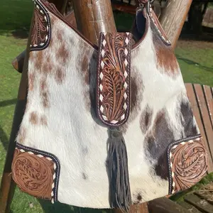 Cowhide purse with tooled leather accents