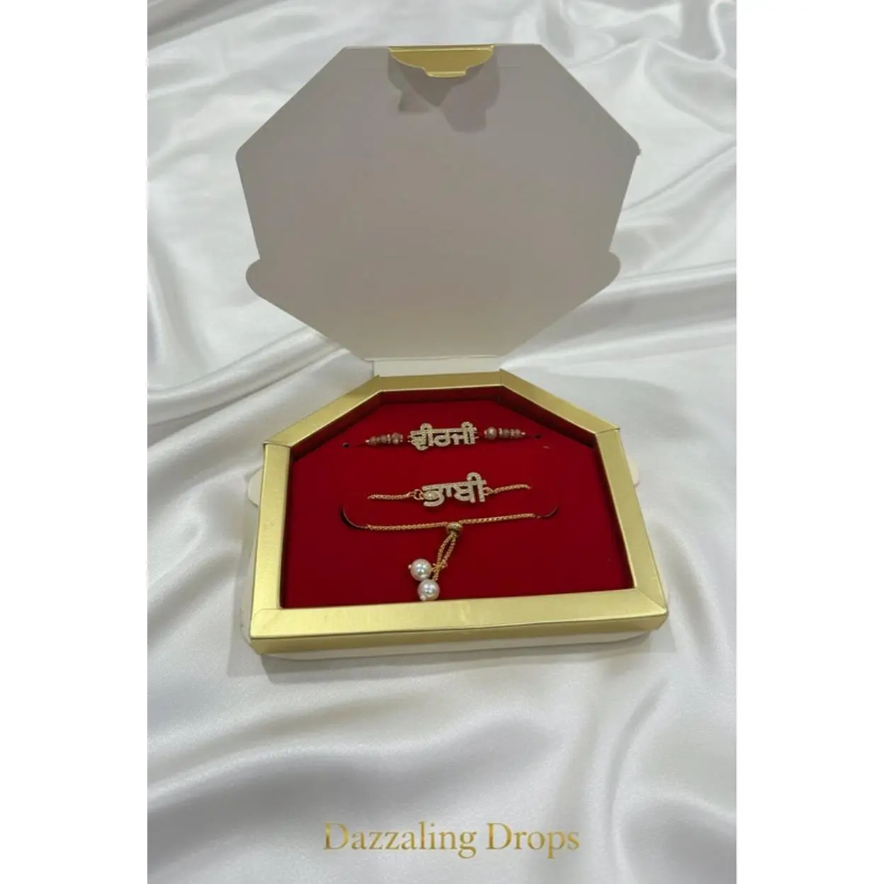 Dazzaling Drops Sohni Bhabhi Rakhi Bracelet - Elegant Gold-Plated Design with Pearl Accents in Luxury Gift Box