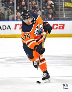 Ethan Bear Edmonton Oilers Unsigned Orange Jersey Shooting Photograph