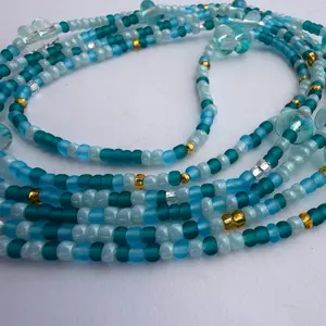 Waistbeads- In To The Deep has Blues and Gold with charms Fits everyone 60 inches fit up to a size 4 XL, 70 inches fits up to a 5 XL.