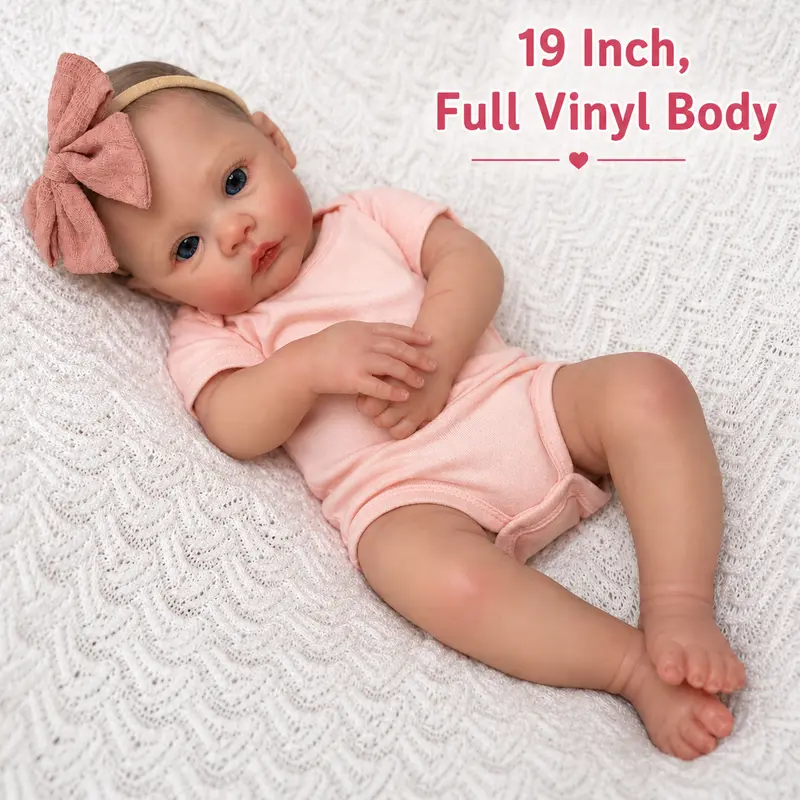 Reborn Baby Doll - 19in Silicone-Vinyl Limbs, Cloth Body, Pink Dress, Poseable Arms, Reborn Look Articulated Soft Doll for 3+ Girls, Ideal Birthday Christmas Gift for Role-Play