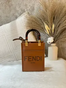 Pre-owned FENDI Mini Sunshine Shopper Tote Bag in warm tan leather. Features the embossed "FENDI ROMA" logo 1919H0830