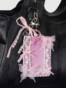 Exquisite style, fashionable atmosphere, plush ball lace pendant with pearl chain and bow elements decoration design, a versatile bag pendant with niche personality texture, and can also be used as a keychain