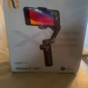 Product Review of Handheld 3 Axis Anti-shake Shooting Stand (1 Count), Rotating Automatic Face Tracking Tripod Stabilizer for Live Video, Phone Accessories, Content Creator Tools from A**l ** **