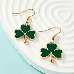 A Pair of Stylish Drop Earrings Featuring Green Clovers, Perfect for Celebrating St. Patrick'S Day