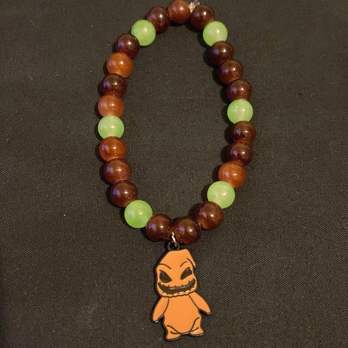 Oogie Boogie Charm Bracelet with Green Beads and brown Character Charm