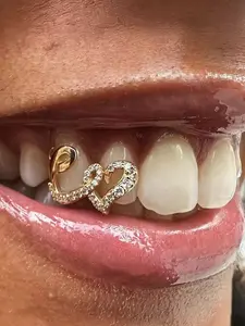 Double Heart Zircon dental crown set, a unique dental accessory, made of copper-inlaid zircon material, can fit into the mouth grade dental glue.