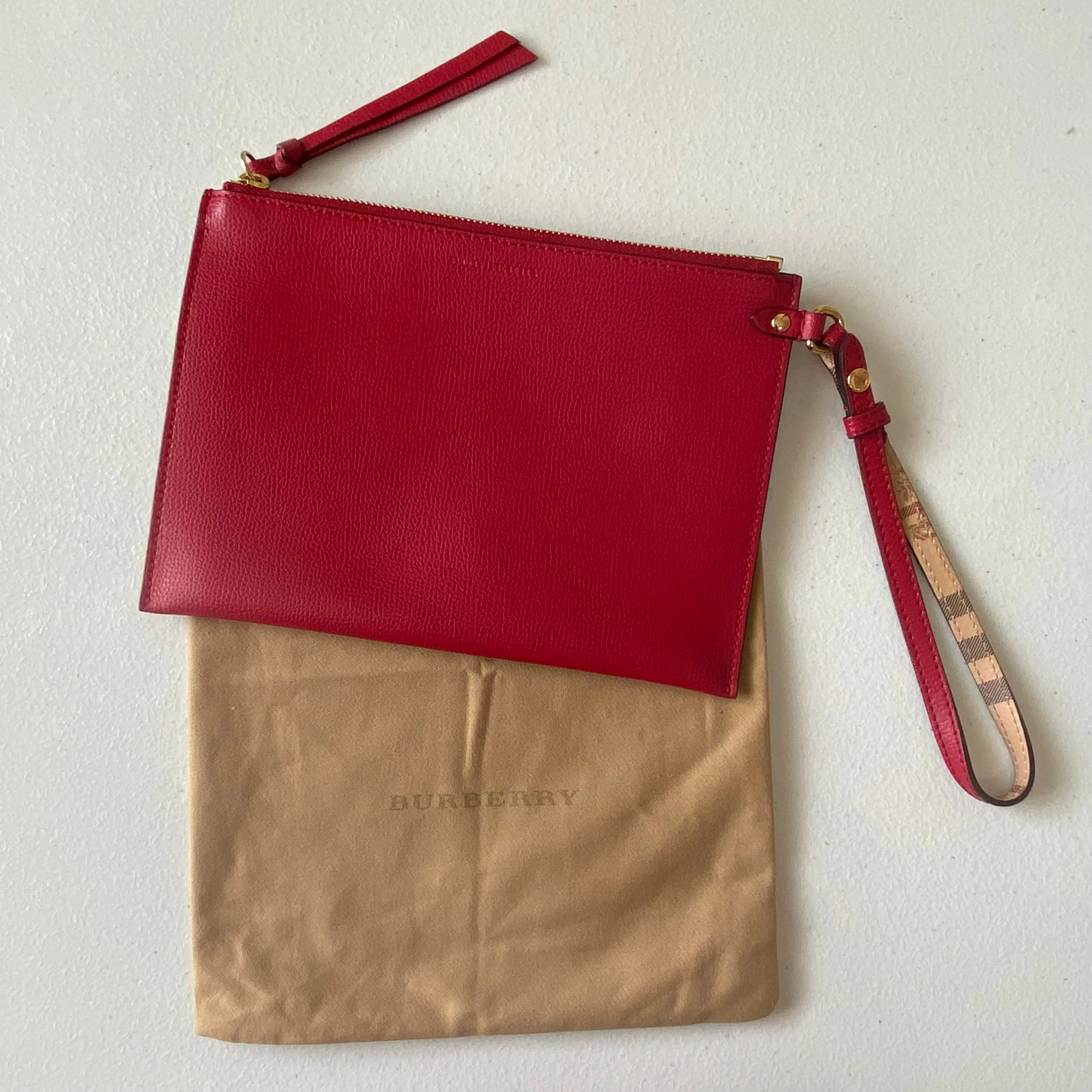 Pre-owned BURBERRY Wristlet Clutches & Wristlets red leather classic check clutch bag Authentic with COA dust bag 9x63