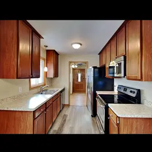 MH HOMES LLC - Elegant Wooden Flooring with Open Door Design for Modern Living Spaces