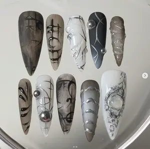 Monochrome Elegance: Abstract Lines and Geometric Design with Bold Silver Accents on Nail Art"