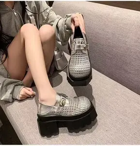 Silver black shiny woven thick soled loafers, one foot elevated flat shoes