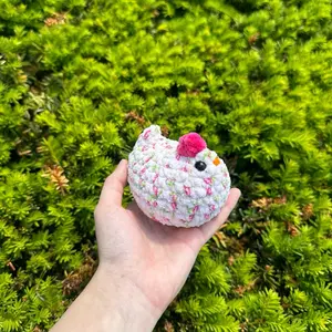 Hand-crocheted rose blossom chicken