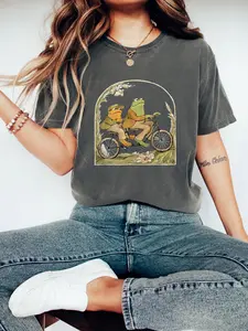Women's Soft Cotton Crew Neck Short-Sleeve T-Shirt Top - Frog and Toad on Bike Graphic, Breathable Relaxed Fitted Fabric, Book Lover Gift, Classic Story-Inspired Gen Z Aesthetic Wholesome Summer Streetwear Clothes