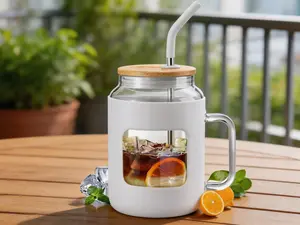 50 oz glass water bottle with silicone sleeve. Comes with lid, straw and handle. BPA-free glass tumbler, ideal for iced coffee and daily drinks.