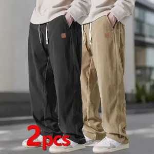 Two-piece loose casual pants, simple and versatile style, elastic waistband suitable for various body types, side pockets for convenient storage, wide straight leg design allows free movement, decorative label with stylish design,  Menswear Trouser