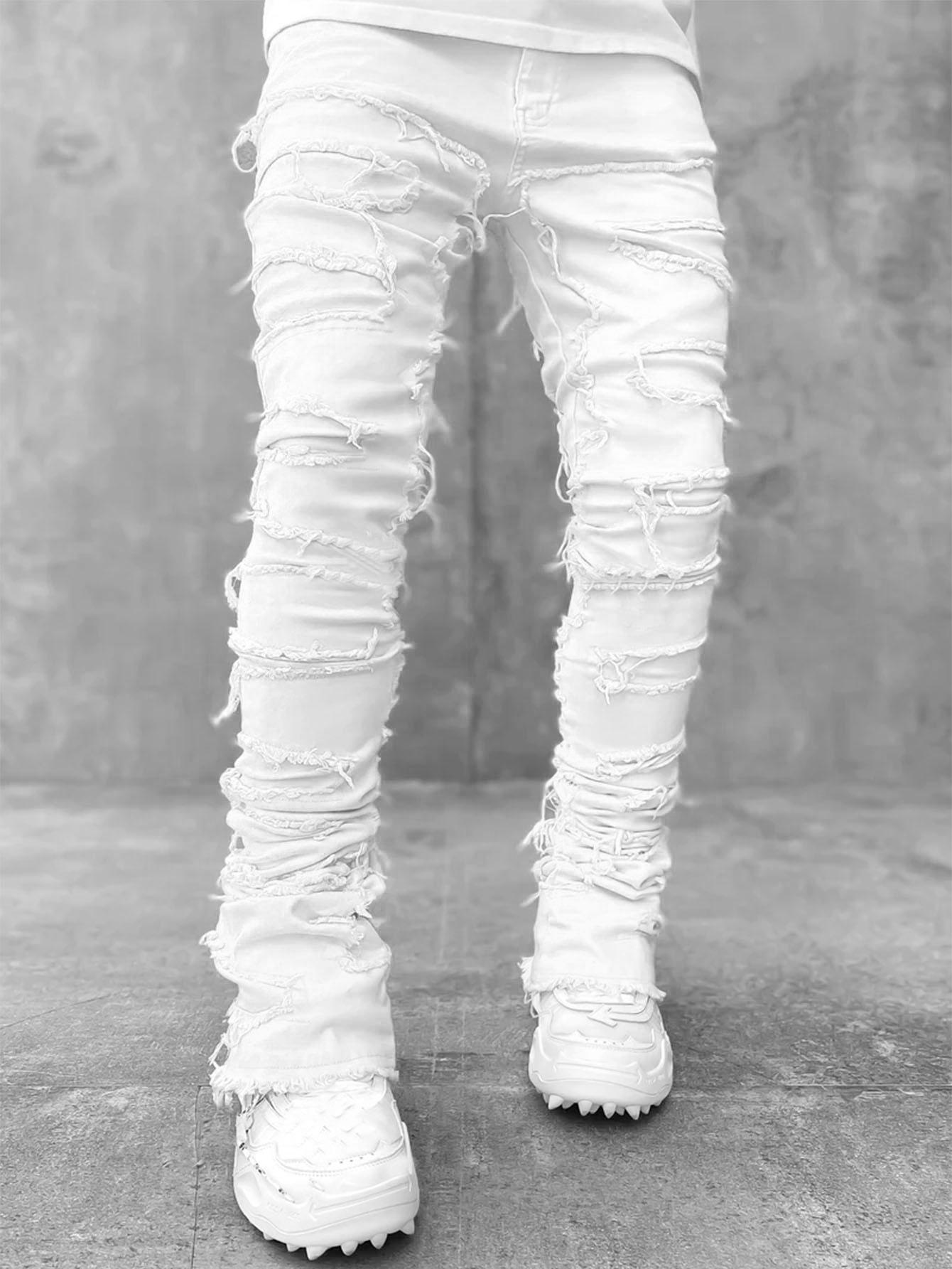 Men’s light-wash stacked flare jeans with heavy frayed patches