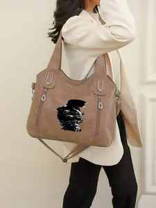 This Michael Jackson pattern handbag features a zip closure and is perfect for the back-to-school season or as a New Year's gift.