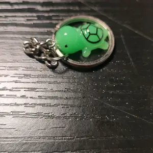 small dark green turtle key chain
