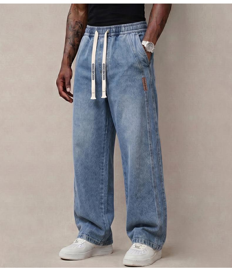 Men’s jeans made from stretchy cotton—comfortable and stylish. Loose fit for everyday wear; long pants with a drawstring elastic waistband design for men.