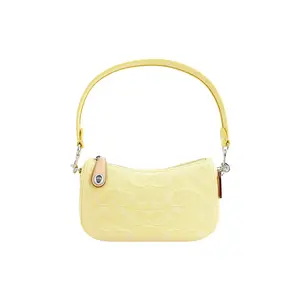 COACH Swinger 20 Letter Logo Zippered Embossed Saffron Leather-and-Denim Half-Moon Handbag for Women