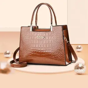 Brown gator print hand and shoulder bag