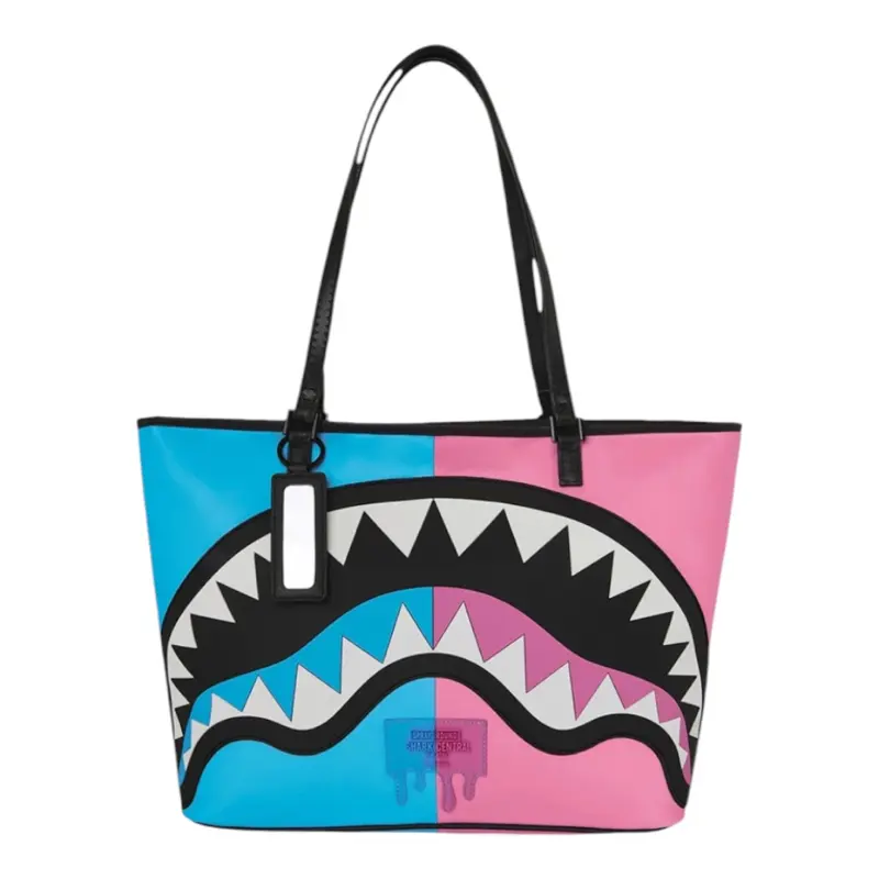 Sprayground Shark Mouth Tote Bag - Blue and Pink Color Block Design with Bold Shark Teeth Pattern and Black Handles