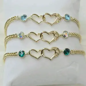 Pulsera de 2 corazones entrelazados  y cristales 6.5 + extensión 8 inch Laminado de alta calidad
