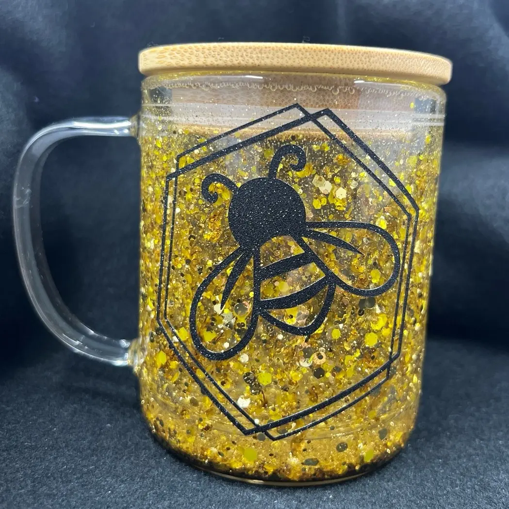 9 oz glass Snow Globe Coffee cup with gold glitter and honeybee.