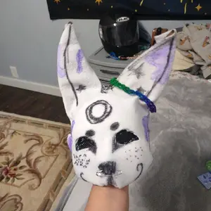Therian Mask -p Associated Image Description - Image Shows White Object with Purple Accents and Black Details