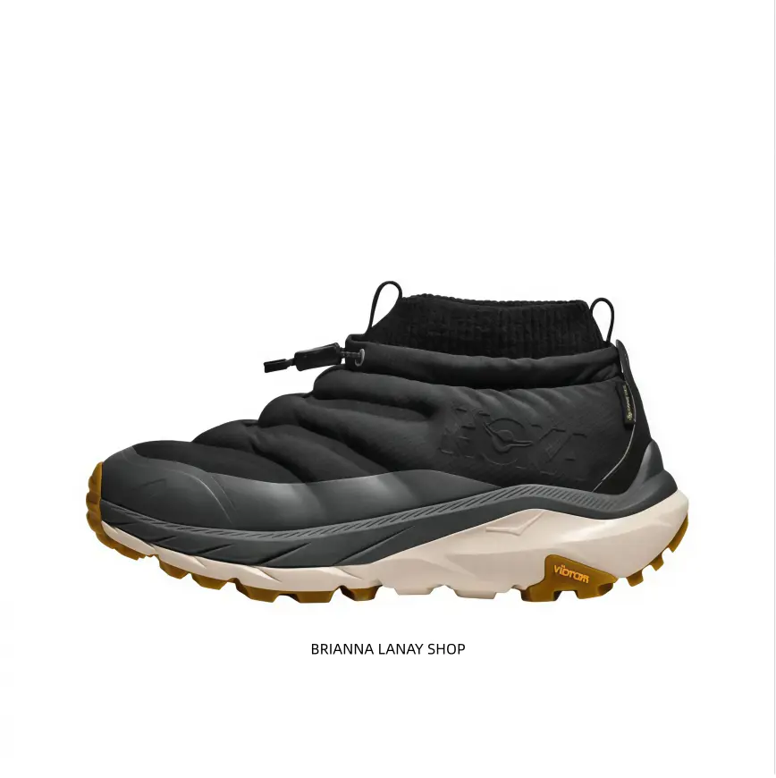 Eye‑catching two‑tone mid‑top snow boots features black puffy upper, creamy‑white thick midsole and golden lug outsole, perfect blend of outdoor functionality and modern street fashion look for cold season