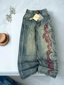 Y2K embroidered loose jeans, unisex design. Rock/hip-hop retro style. Casual high-waisted wide-leg pants. New street fashion with large graphic prints that showcase an avant-garde street look.