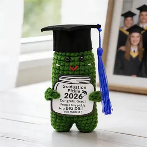 A cute, handcrafted crochet doll ornament—the perfect small gift for graduation season, ideal for desktop decoration.