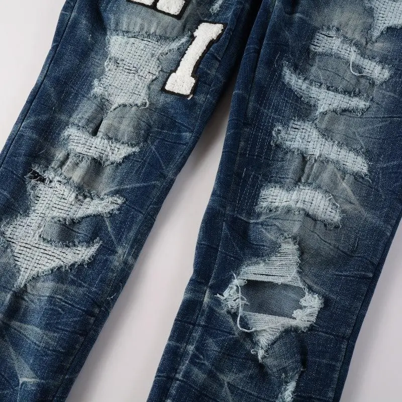 Men’s trendy slim-fit jeans from European and American high street fashion, featuring embroidered lettering, ripped patches, and stretch fabric Men’s trendy slim-fit jeans from European and American high street fashion, featuring embroidered lettering, ripped patches, and stretch fabric