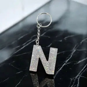 Silver strand letter keychain