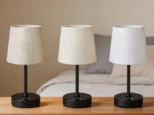 Cordless rechargeable table lamp with 5000mAh battery. Features 3 color modes, 7 RGB effects and stepless dimming. Portable touch control design with fabric shade, suitable for indoor and outdoor use.