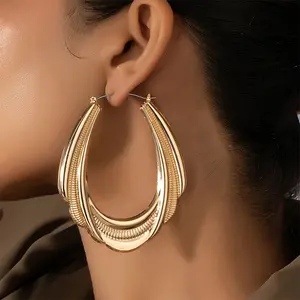 1 Pair Minimalist Geometric Hoop Earrings - Exaggerated Irregular Oval Design, Golden-Tone Metal, Lightweight Everyday & Gift Jewelry for Women, Quirky Earrings